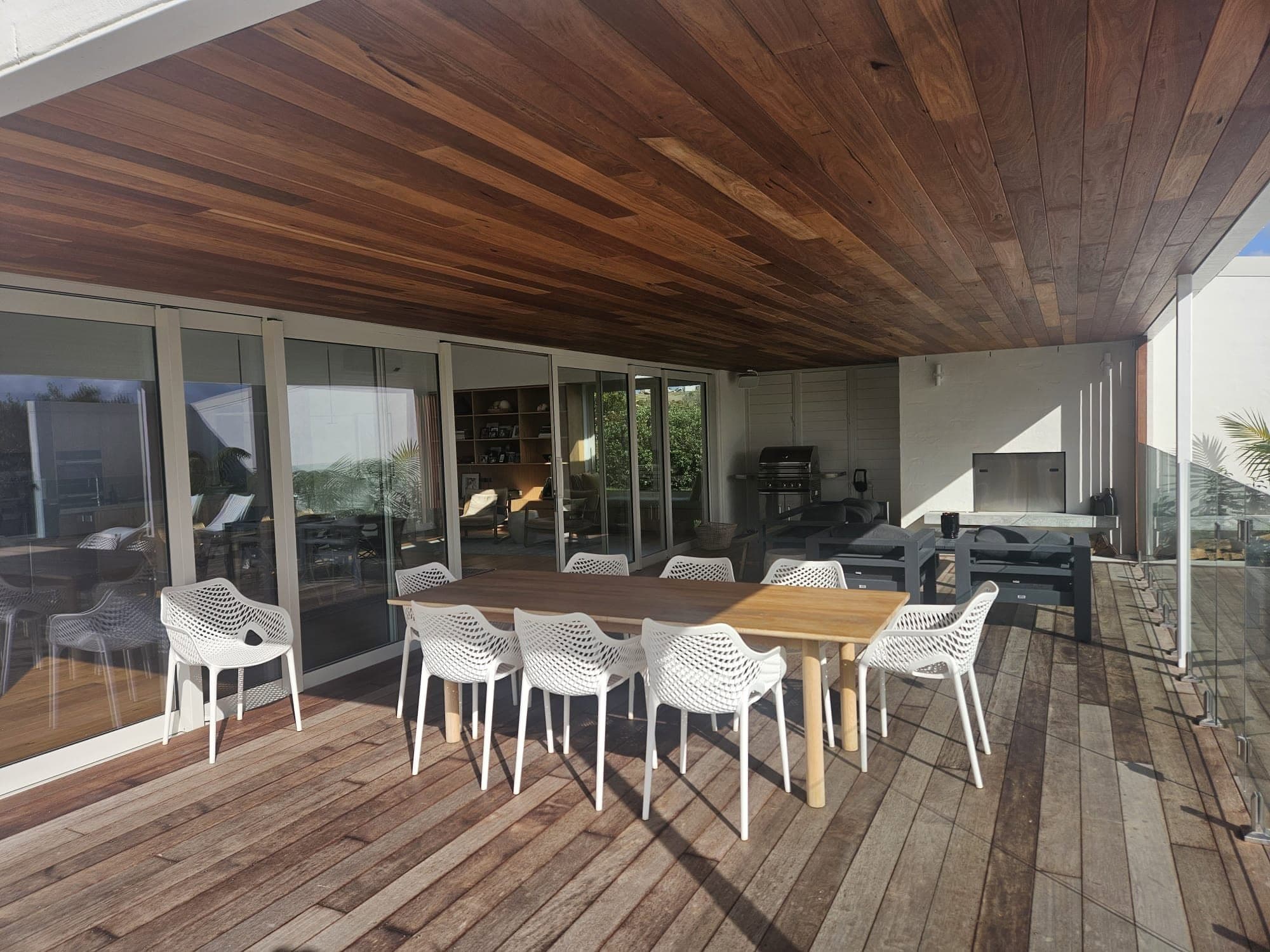Covered outdoor deck with timber-lined ceiling